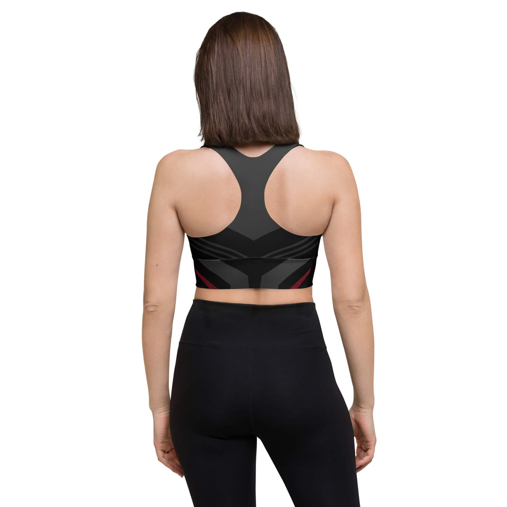 Rückansicht des schwarz-anthrazitfarbenen Longline-Sport-BHs am dunkelhaarigen Model