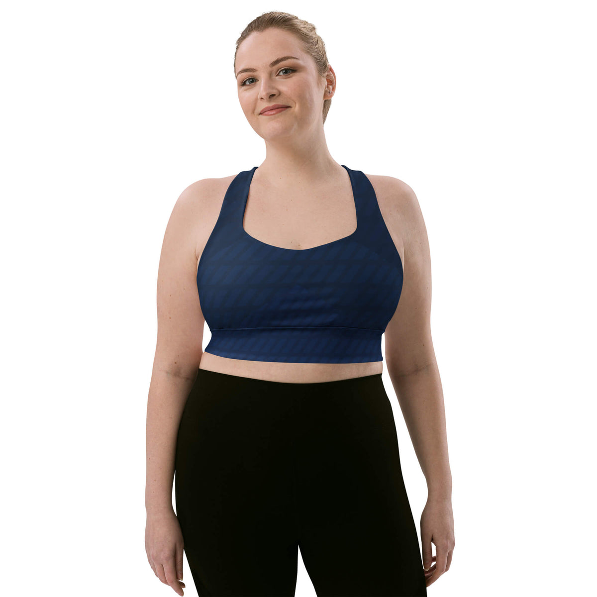 Blondes Model von vorne: Model trägt dunkelblauen Longline-Sport-BH zu schwarzen Leggings, Vorderansicht.